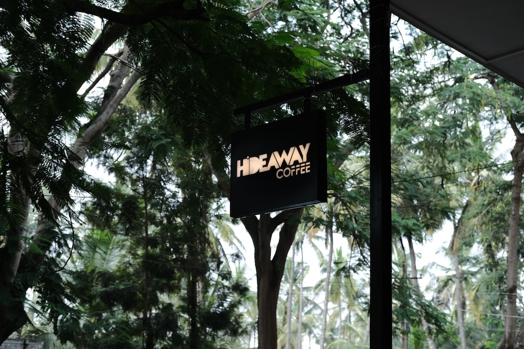 Signboard for Hideaway Coffee cafe with its distinctive branding
