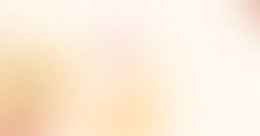 Warm, softly blurred background featuring gentle shades of cream, peach, and pale yellow with subtle pink and orange tones creating a sunlit, dreamy effect.