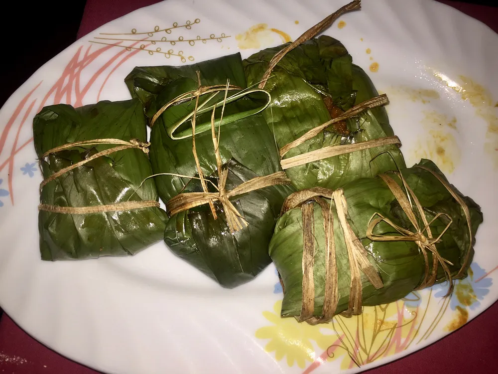 Freshly caught and cooked fish wrapped in leaf